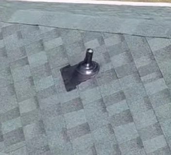 Roof vent with flashing installed on asphalt shingle roof